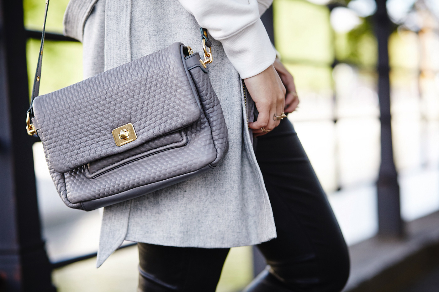 Casual College Outfit | Masha Sedgwick is wearing a sweater from Alexa Chung for AG, black leather pants, grey Sonia Rykiel bag and grey Kala vest | Berlin street style width=