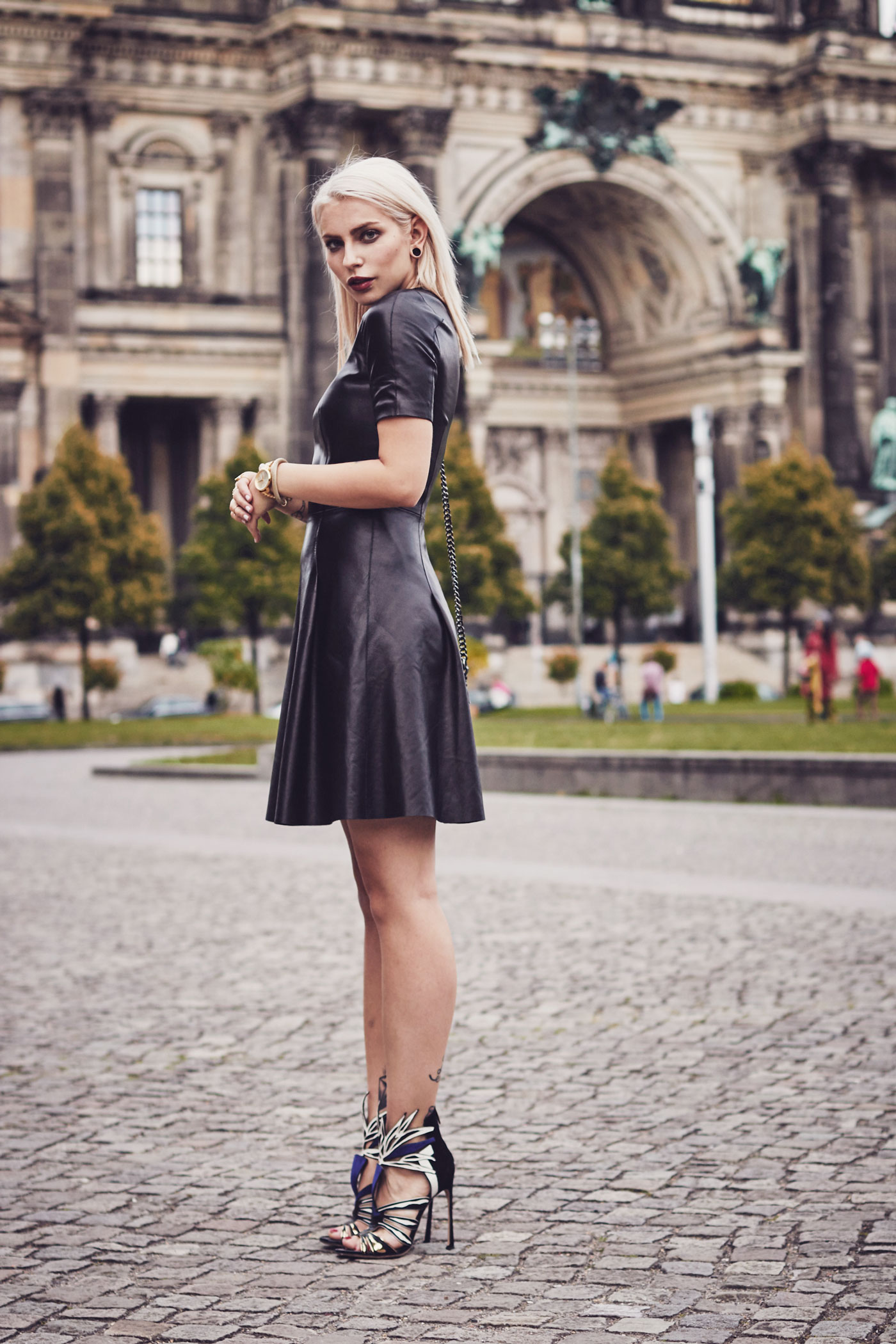 My elegant outfit wearing a leather dress from Mulberry, a vest from Dimitri and Sergio Rossi Heels | This outfit was shot in Berlin in front of the 