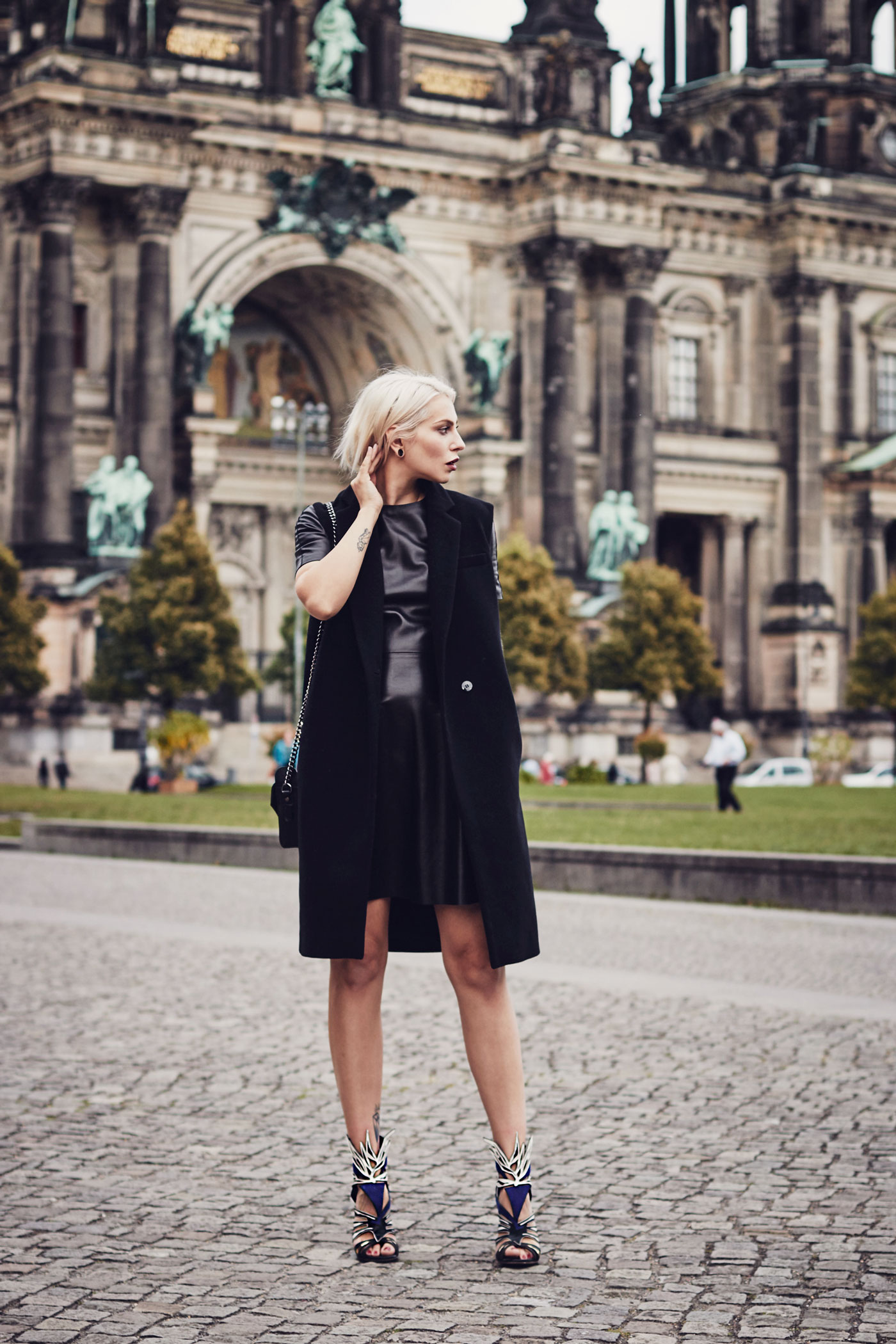 My elegant outfit wearing a leather dress from Mulberry, a vest from Dimitri and Sergio Rossi Heels | This outfit was shot in Berlin in front of the 