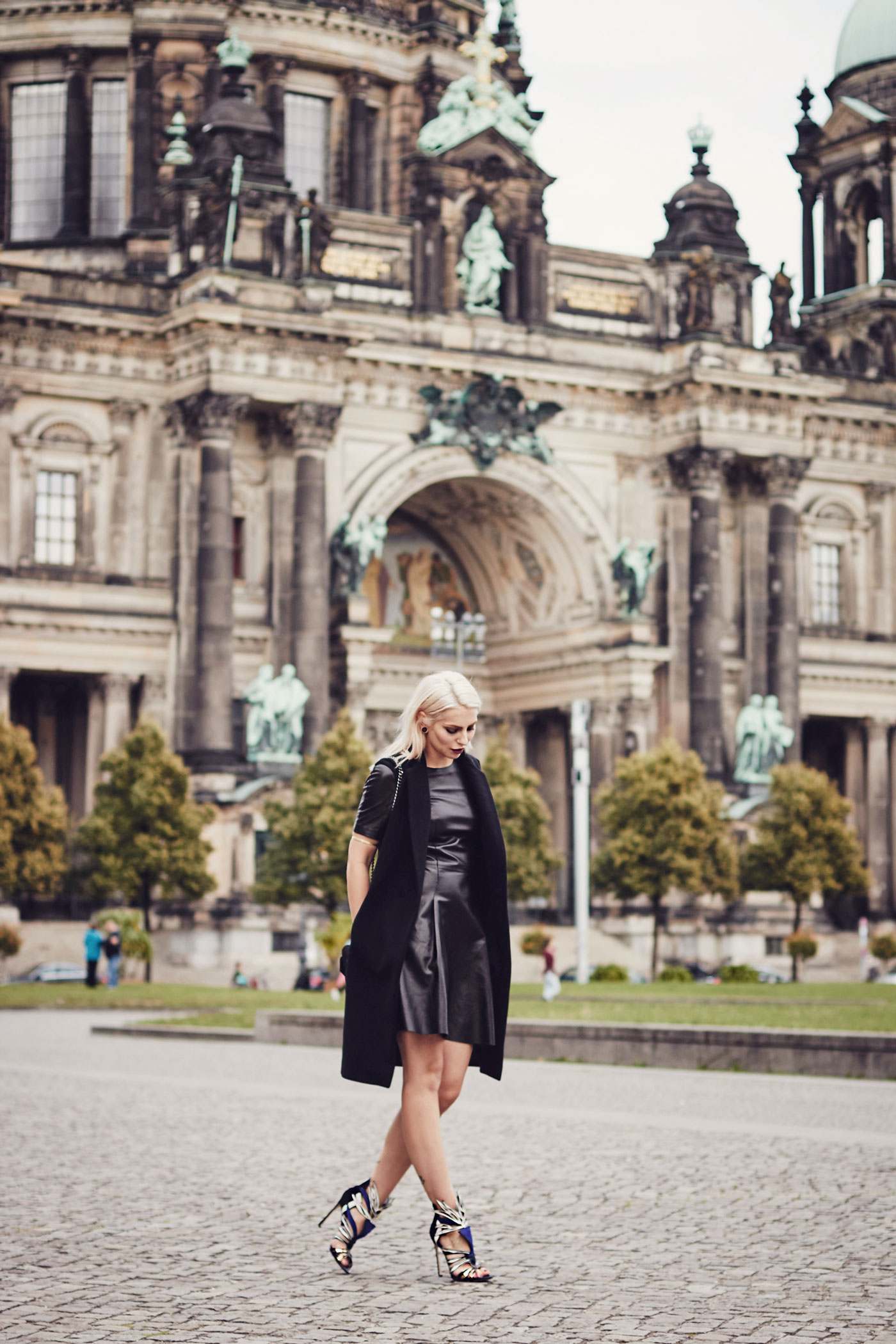 My elegant outfit wearing a leather dress from Mulberry, a vest from Dimitri and Sergio Rossi Heels | This outfit was shot in Berlin in front of the 