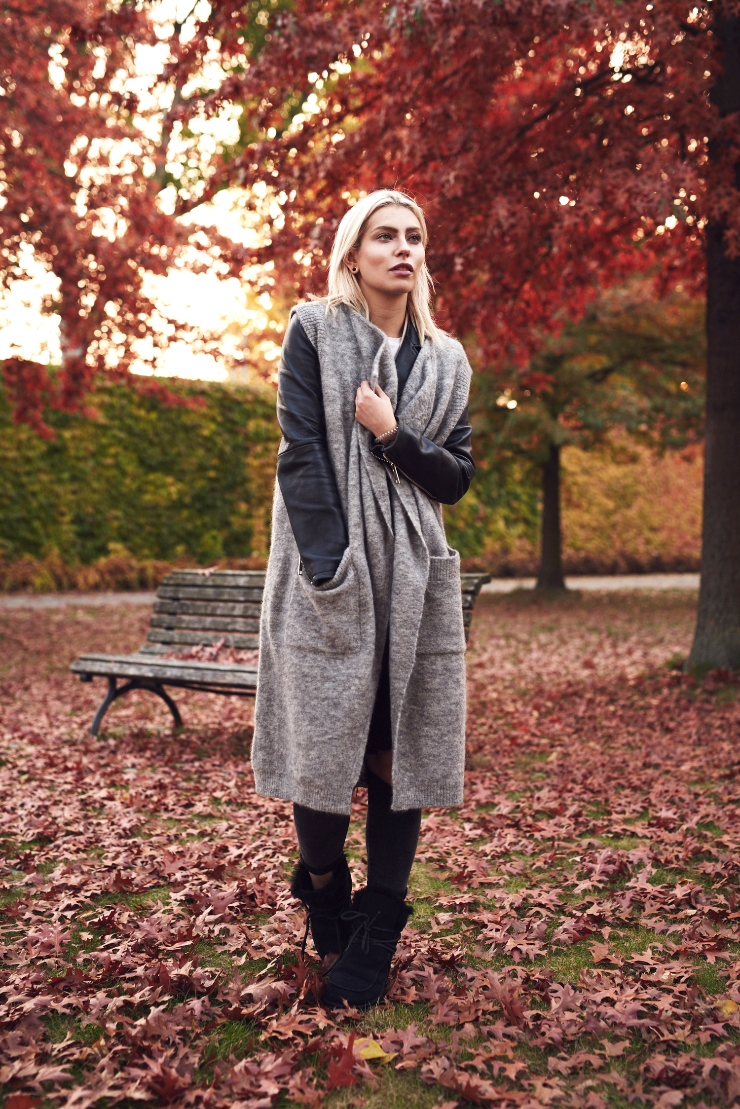 via fashion blogger Masha Sedgwick | outfit taken in Berlin Tiergarten | wearing EMU sheepskin boots, a wool vest and destroyed jeans | fall and winter style