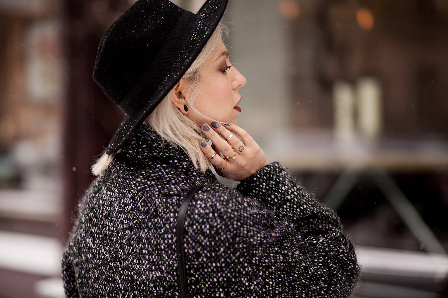 view more details on my blog | wearing black boots with a star from Love Moschino, an oversized wool coat from Marimekko, a black bag from Saint Laurent and a black jeans from AG | black, edgy, winter fashion | street style taken in Berlin | snow