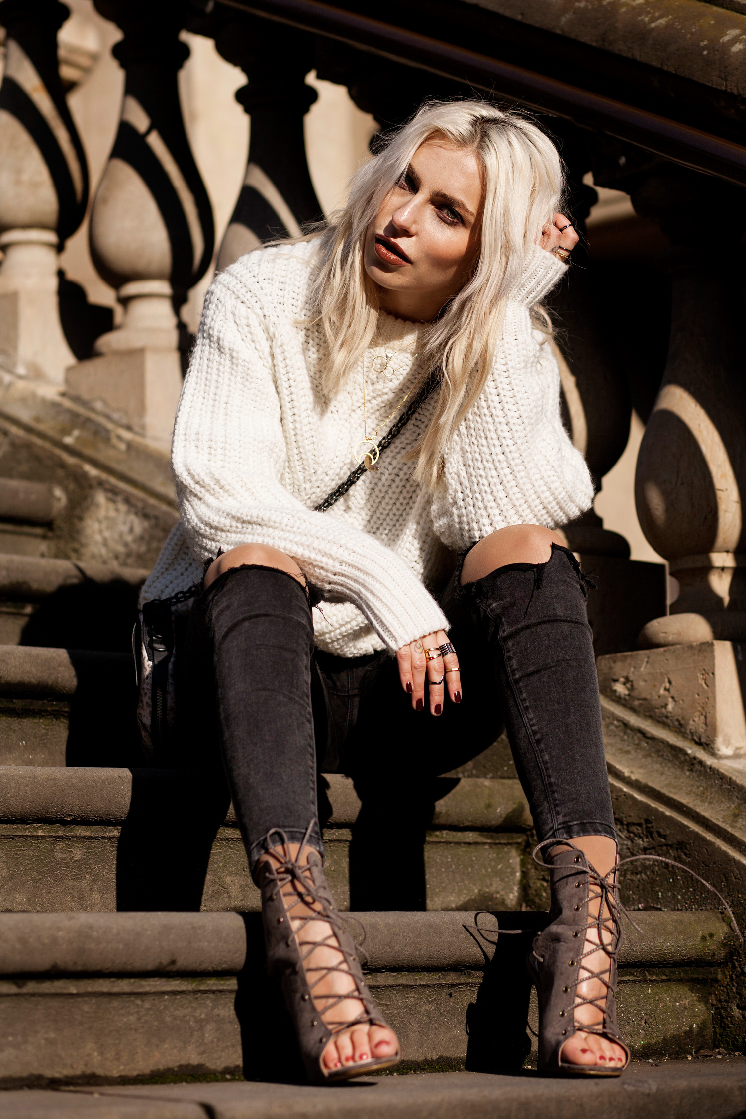 view the full outfit on my blog | lace up boots from Missguided | black jeans | white sweater (knitwear) | snake bag from rag & bone | winter style taken in Berlin