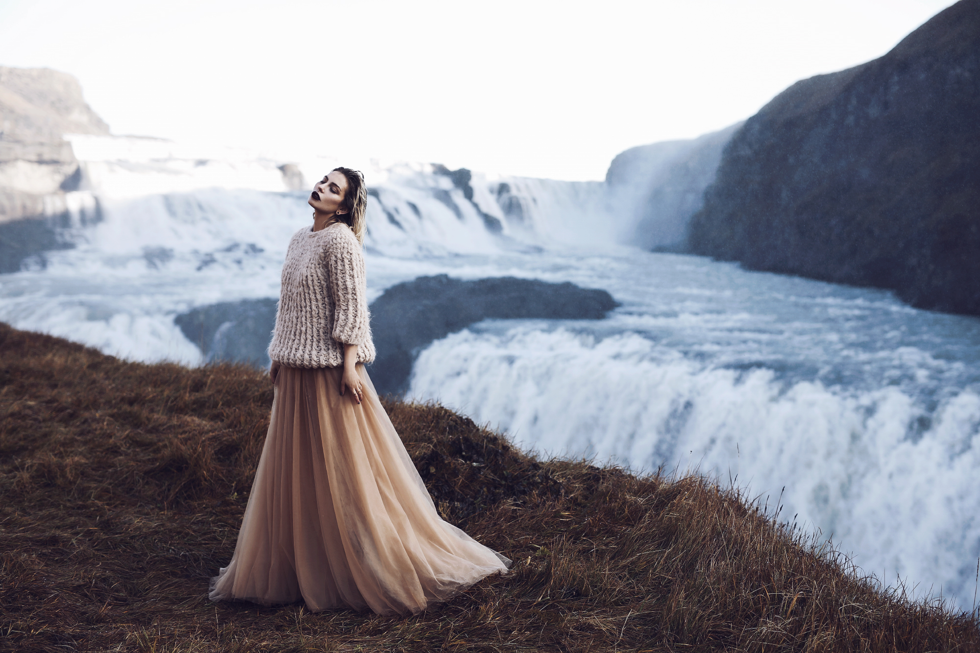 Waterfall in Iceland | Editorial Fashion Shooting for mybestbrands | style: feminine, melancholic, winter princess