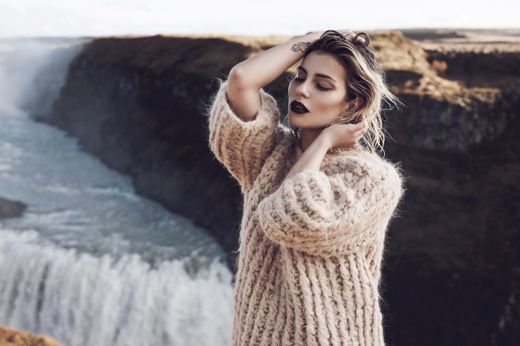 Waterfall in Iceland | Editorial Fashion Shooting for mybestbrands | style: feminine, melancholic, winter princess