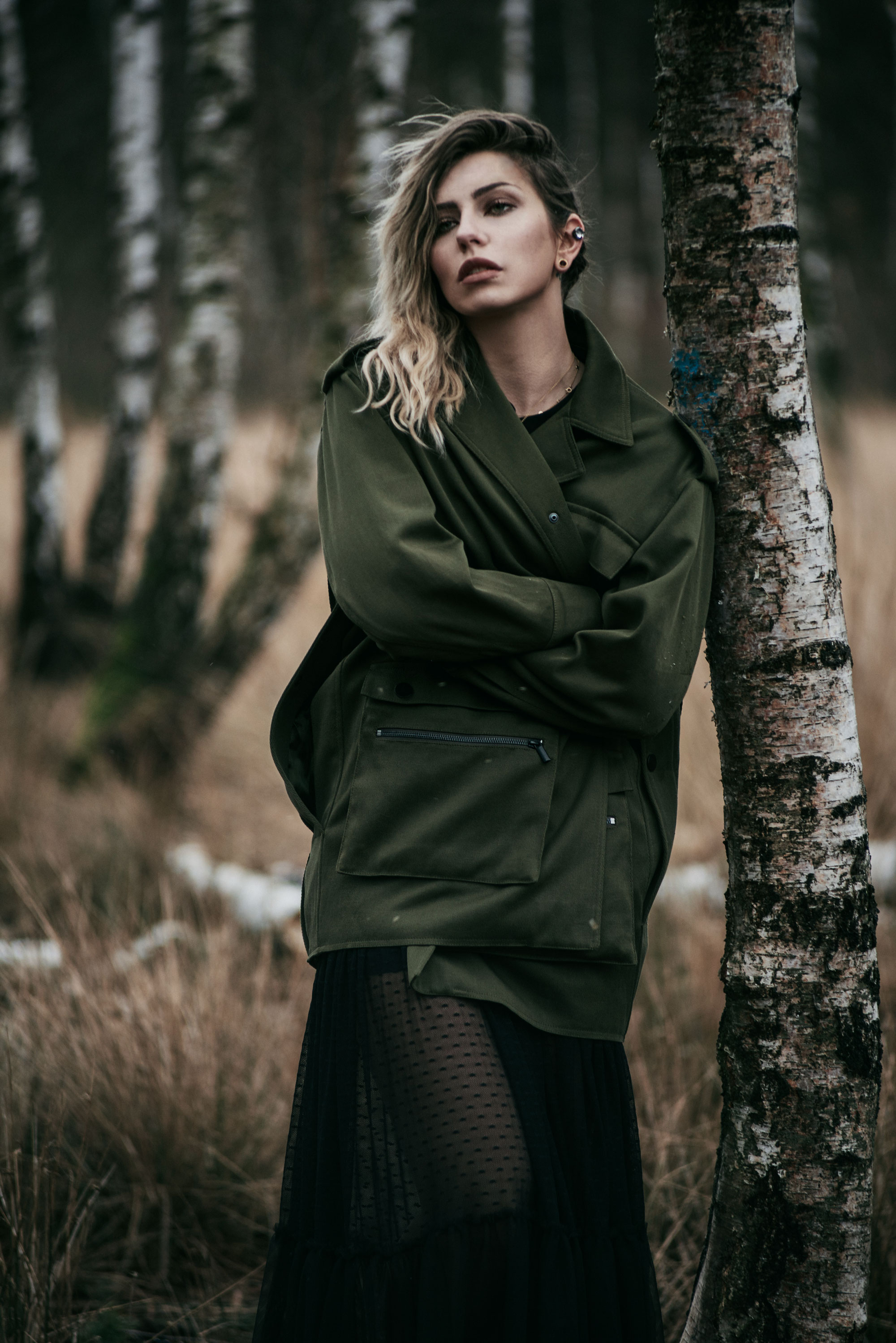 emotional fashion editorial in a birch forest | outfit style: dark, sad, grunge, edgy, goth, sexy | Vogue, black maxi skirt and military coat