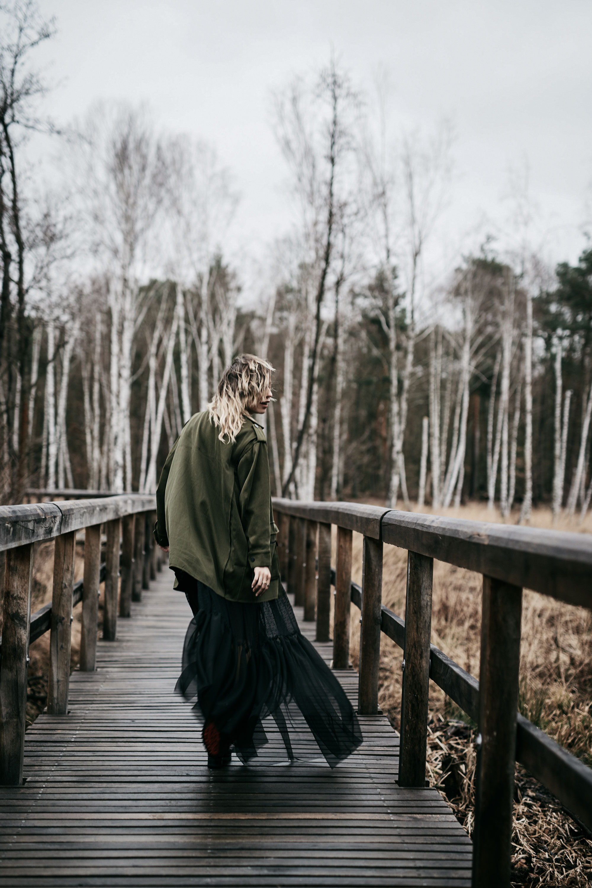 emotional fashion editorial in a birch forest | outfit style: dark, sad, grunge, edgy, goth, sexy | Vogue, black maxi skirt and military coat