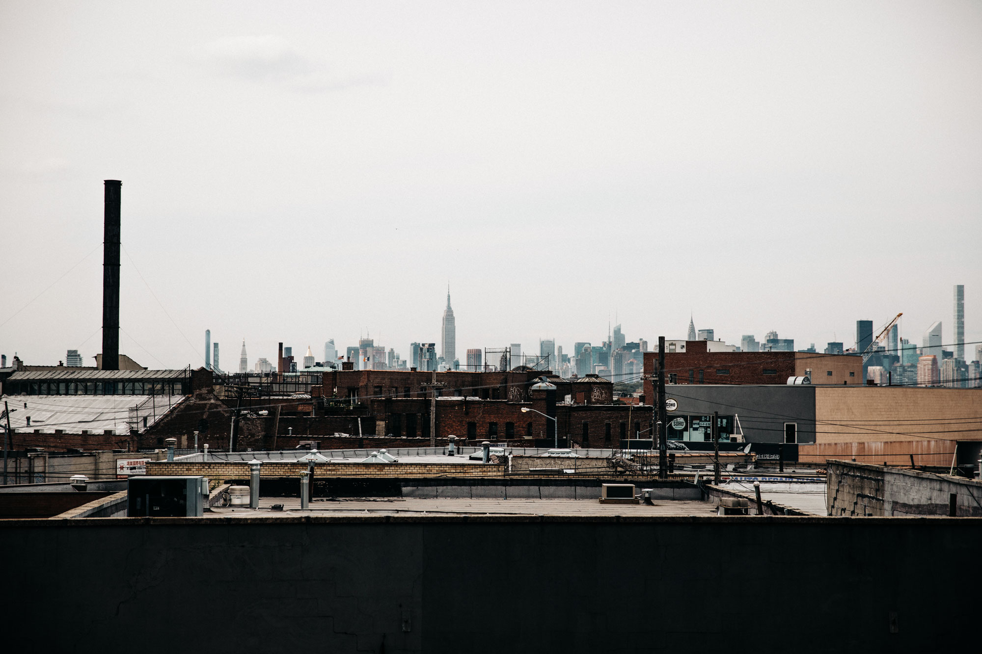 shooting on a rooftop in Brooklyn, NYC | New York | fashion | Editorial | Style | blogger Masha Sedgwick | products: Adriana Metallic Sneakers from Acne Studios, bomber jacket from 3.1 Phillip Lim, black denim skirt from  Levi's | photos: Theresa Kaindl | topic: Random Facts | edgy, sexy, sporty, grunge, cool, casual