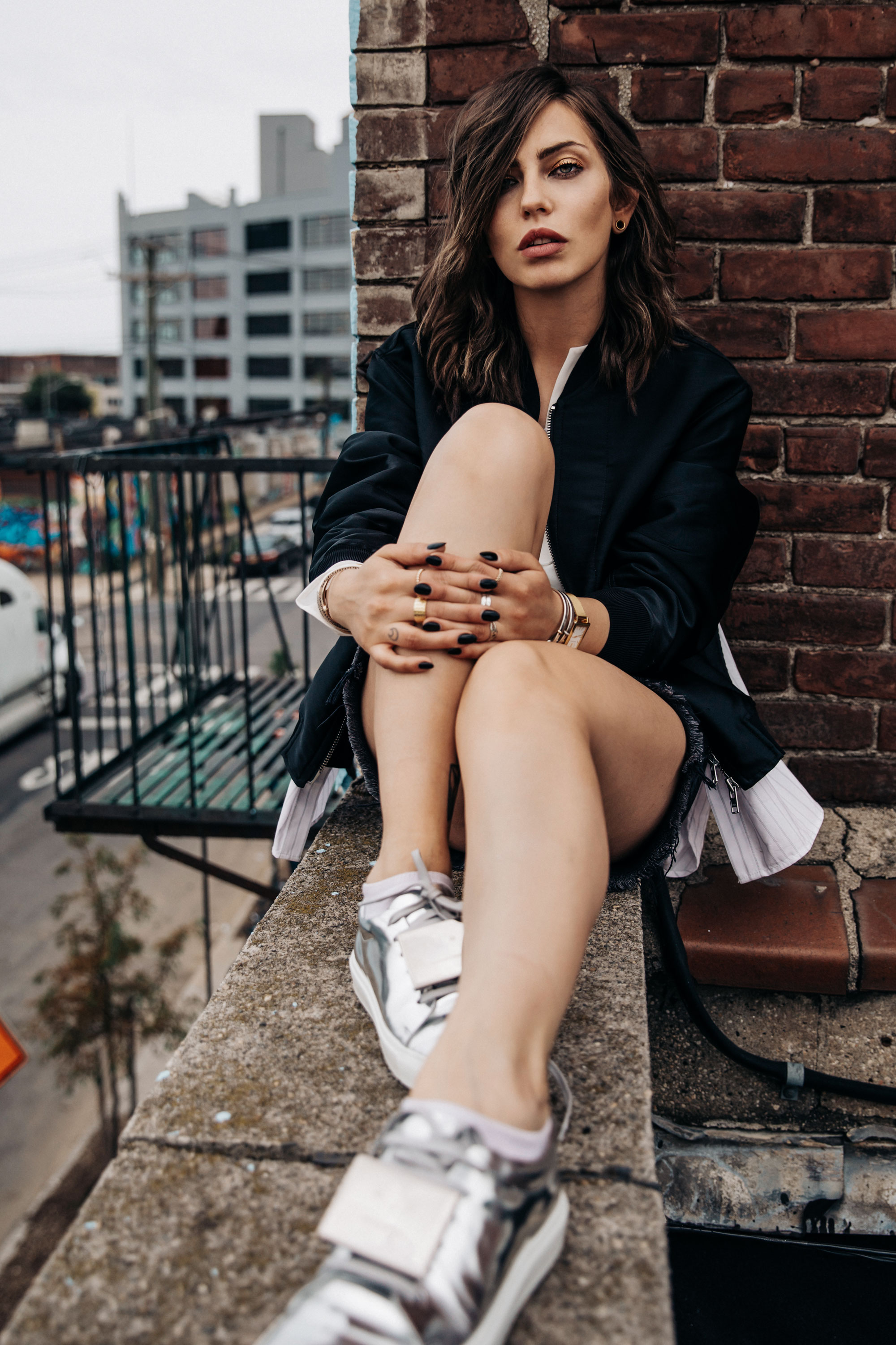 shooting on a rooftop in Brooklyn, NYC | New York | fashion | Editorial | Style | blogger Masha Sedgwick | products: Adriana Metallic Sneakers from Acne Studios, bomber jacket from 3.1 Phillip Lim, black denim skirt from  Levi's | photos: Theresa Kaindl | topic: Random Facts | edgy, sexy, sporty, grunge, cool, casual