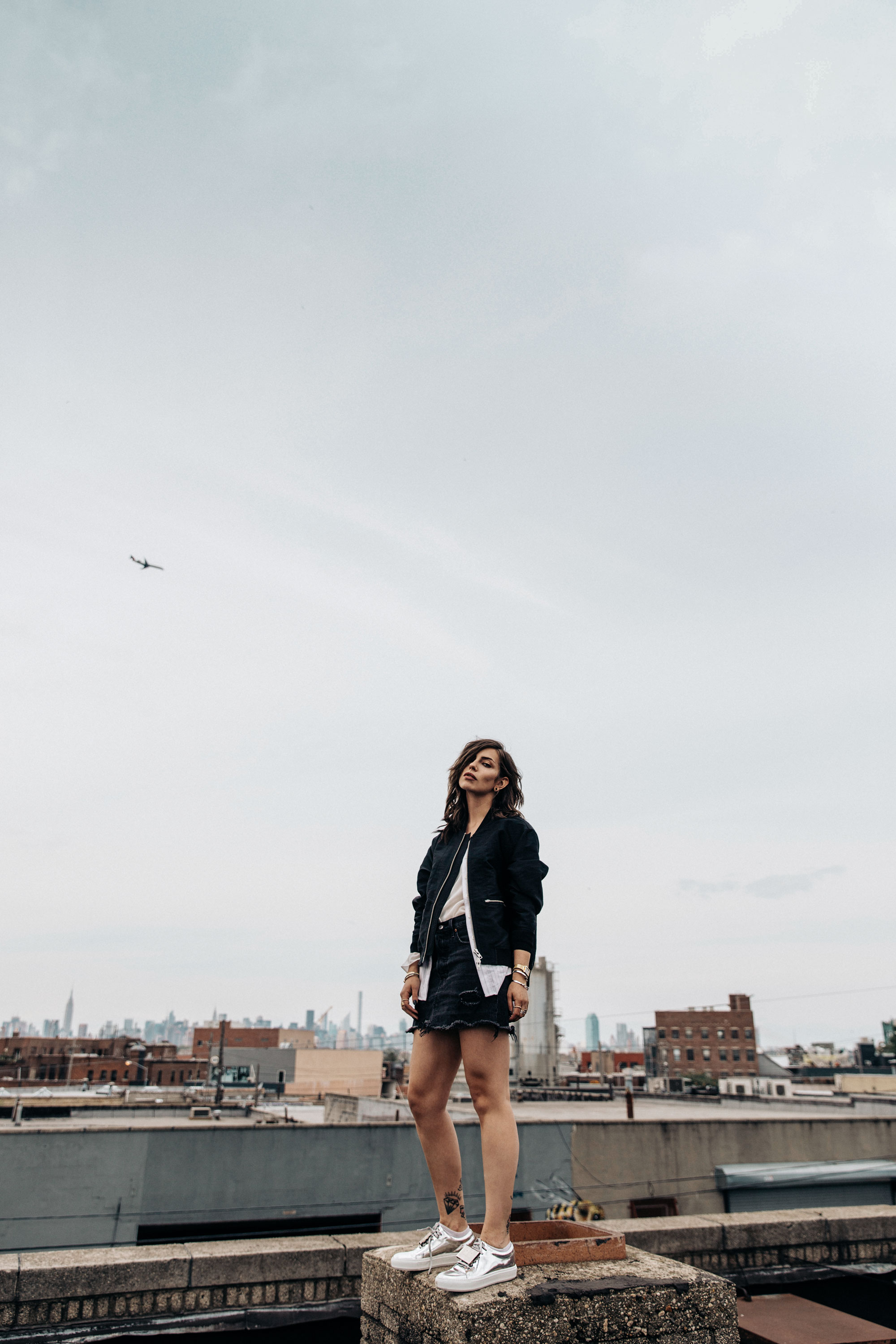 shooting on a rooftop in Brooklyn, NYC | New York | fashion | Editorial | Style | blogger Masha Sedgwick | products: Adriana Metallic Sneakers from Acne Studios, bomber jacket from 3.1 Phillip Lim, black denim skirt from  Levi's | photos: Theresa Kaindl | topic: Random Facts | edgy, sexy, sporty, grunge, cool