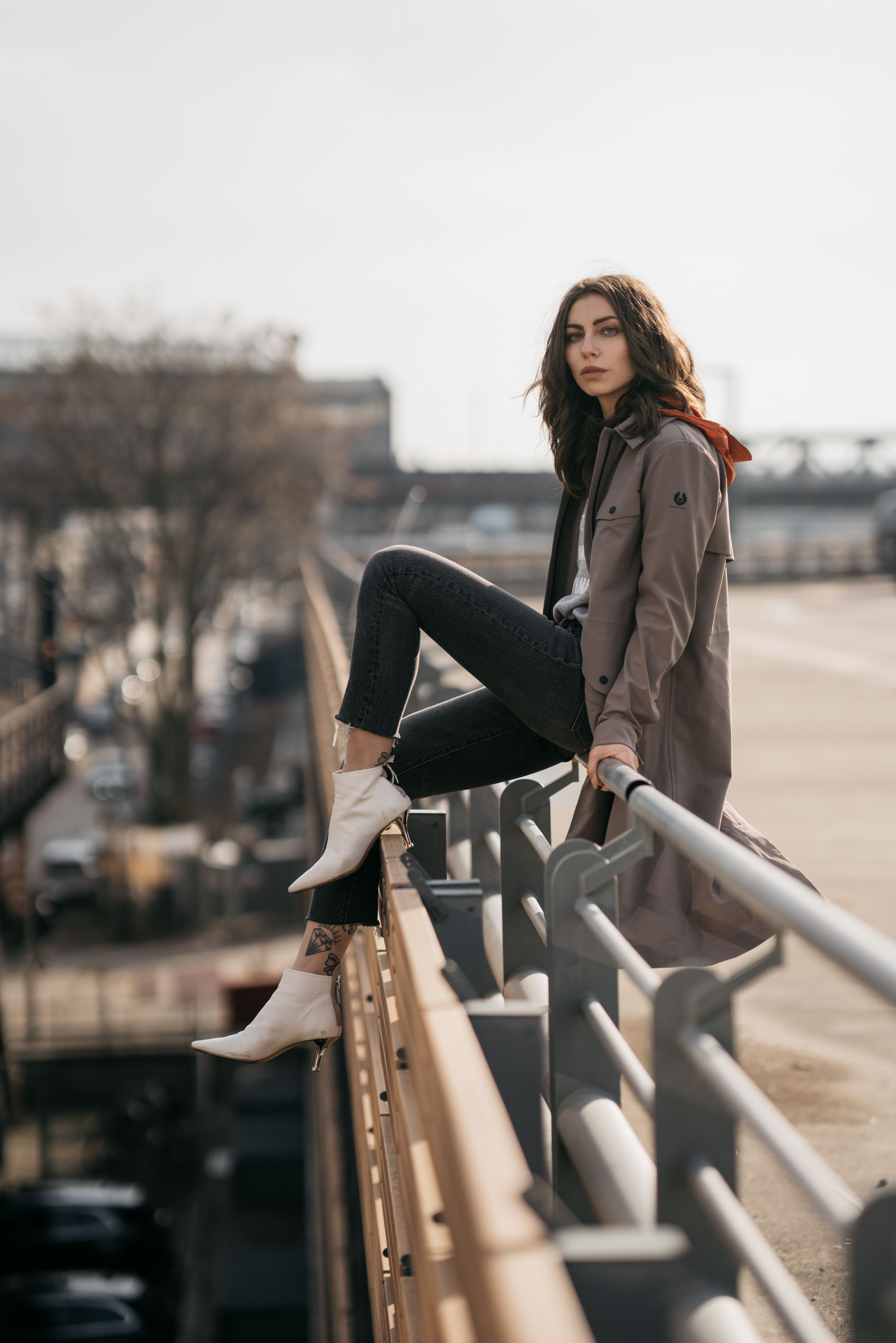 Street Style in Berlin | brands: Belstaff, AGL shoes, Levi's 501 | Trend: rain coat, white boots | BVG | parking lot | shooting | fashion | outfit | ootd