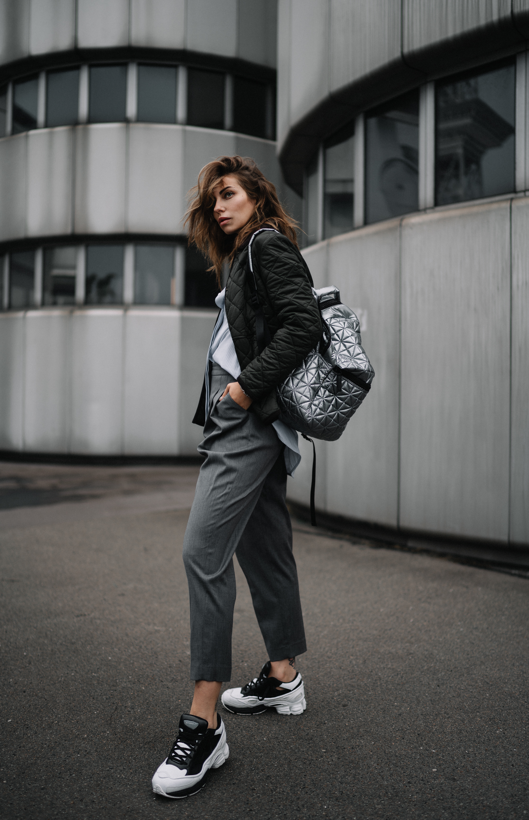 ICC Messedamm Berlin | Fashion & Style | effordless, cool, sporty, Athleisure, Tomboy | wearing: Sneakers from Adidas x Raf Simons, Vee Collective Backpack in silver, Barbour jacket | Architecture Brutalism