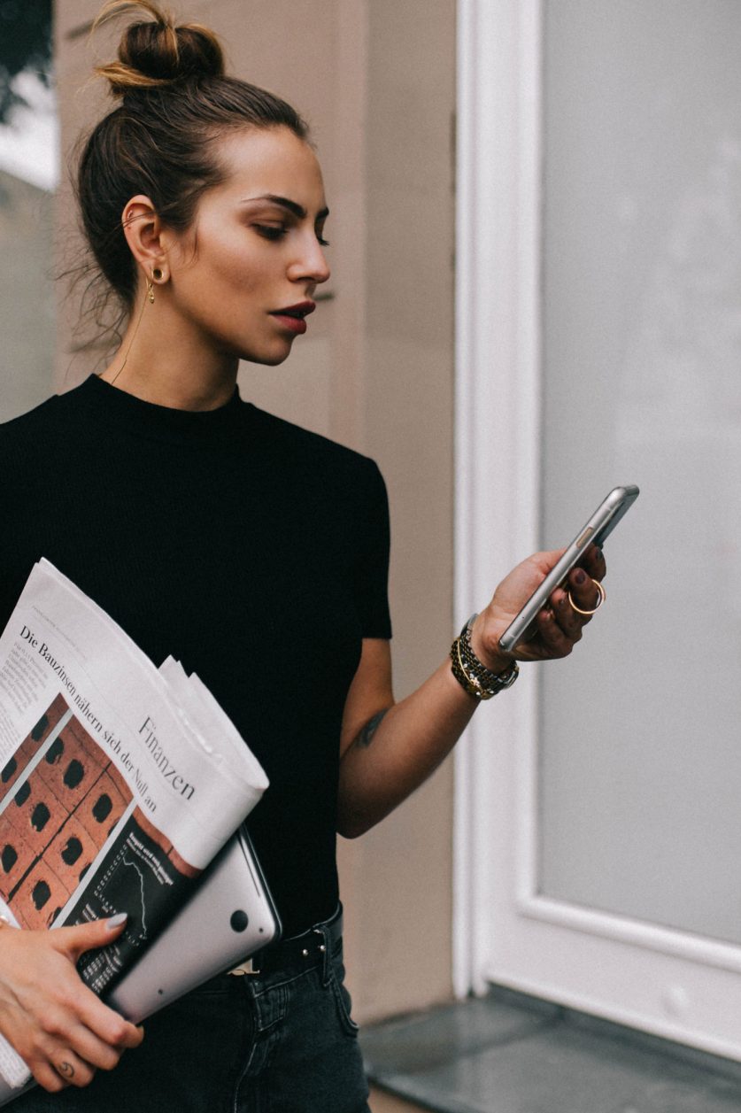 Business lady holding financial magazine from Germany FAZ