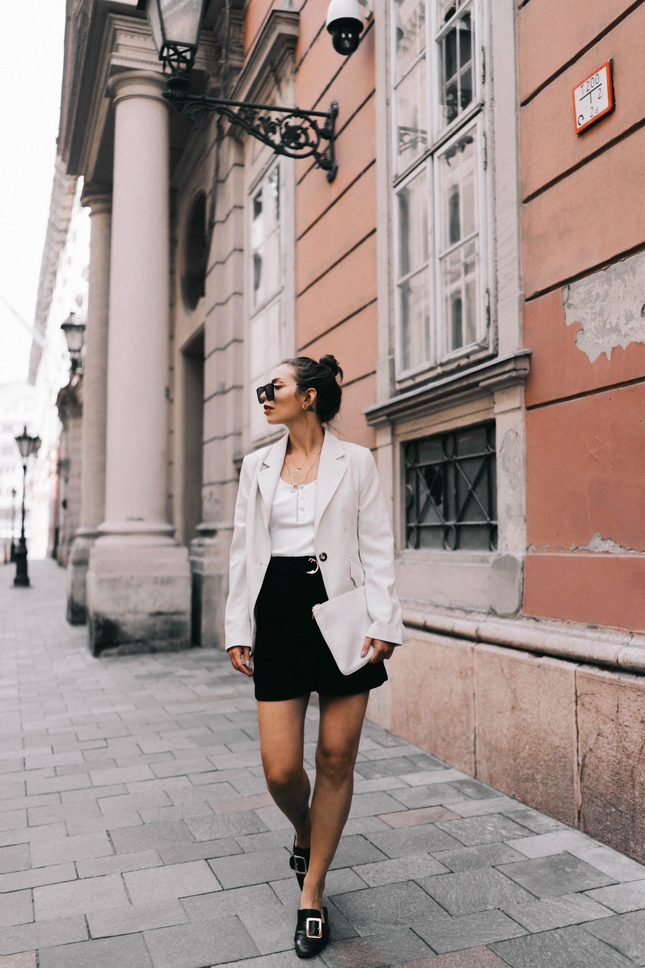 A summer business look for women, Streetstyle from Budapest, Hungary Blazer: Baum und Pferdgarten Top: Gestuz Shorts: H&M Sunnies: Polaroid Loafer: Bally Clutch: Jil Sander