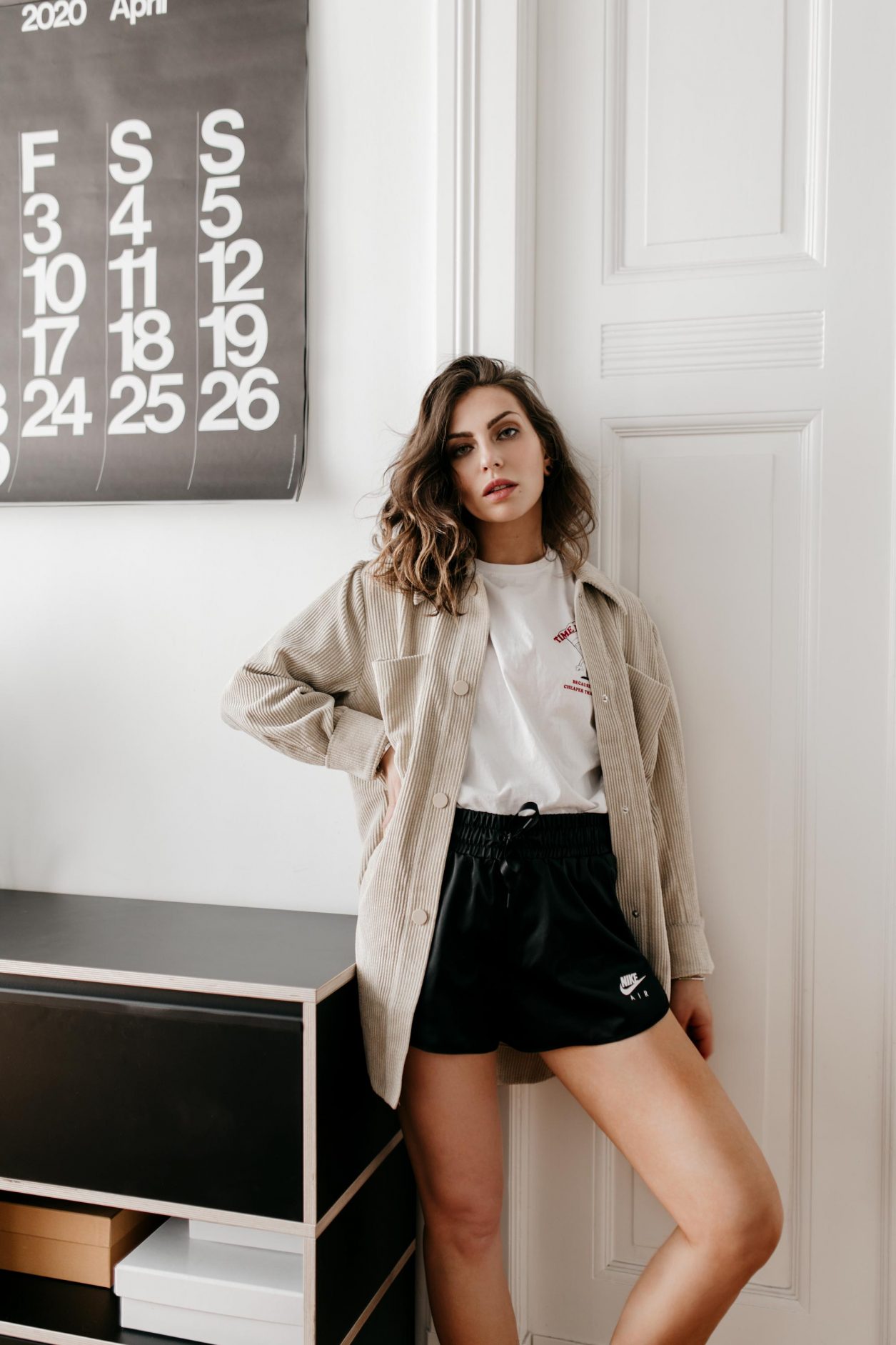 Home Wear Outfit by fashion blogger Masha Sedgwick: wearing beige corduroy shirt from Second Female, white printed shirt from Zalando, black box satin shorts from Nike