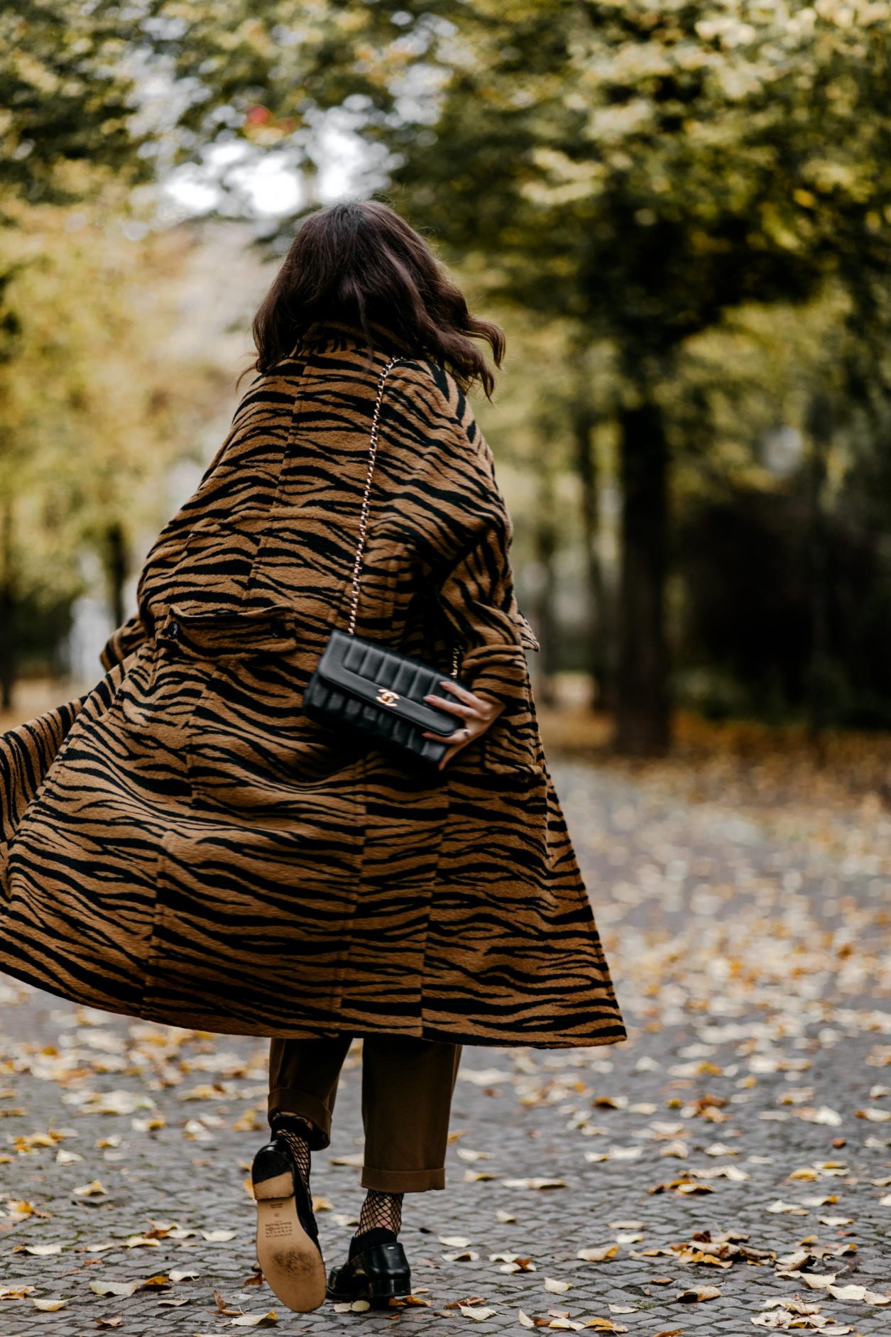 Fashion Blogger Masha Sedgwick | Fall outfit inspiration wearing animal printed zebra Coat: Lala Berlin
Rollneck: Set
Faux Leather Blouse: Gestuz
Pants: Joseph (alt)
Loafer: Maison Margiela
Streetstyle Photographer Tonya Matyu