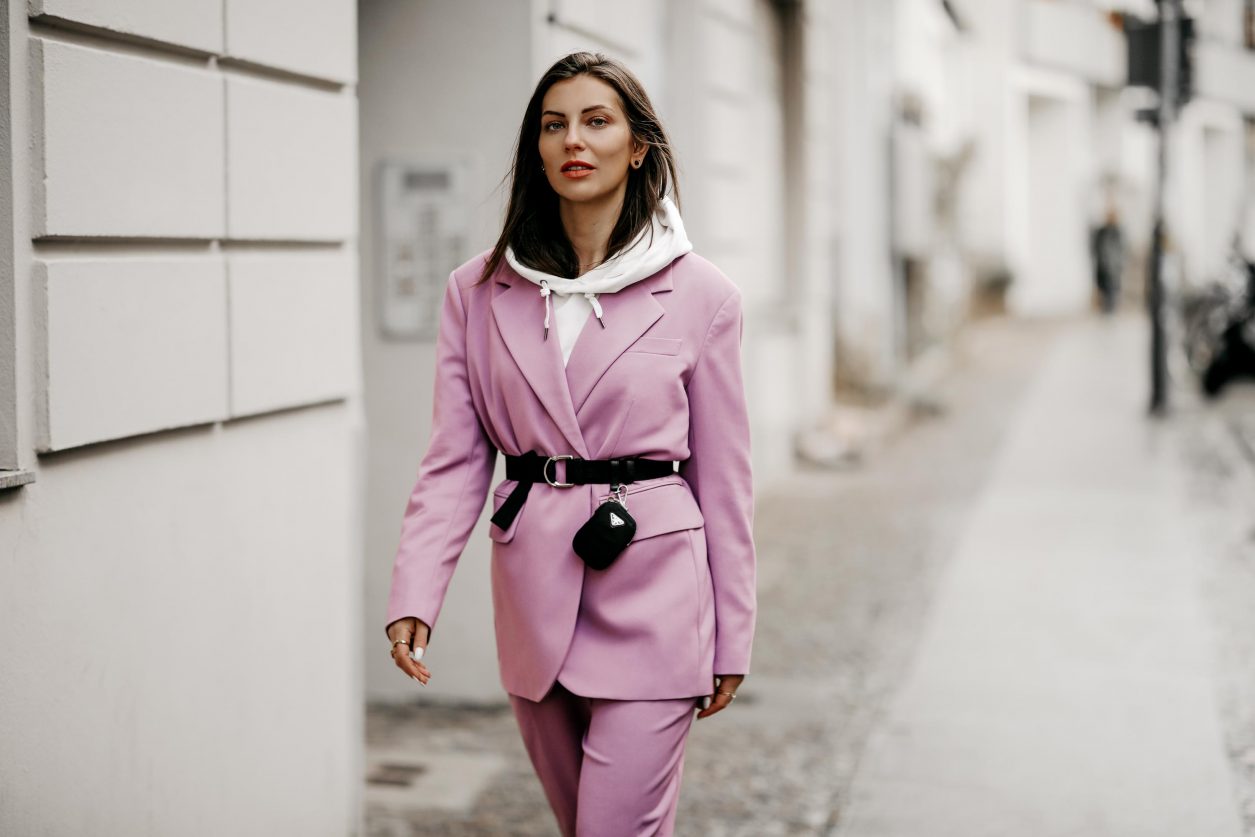 Streetstyle outfit by fashion blogger from Berlin, Germany | Minimalistic everyday outfit, business casual, spring suit ideas, spring colors, ss21 wardrobe must-haves, wearing lilac Market suit, Prada belt with belt-bag, white nail polish, white leather loafer, white hoodie 
